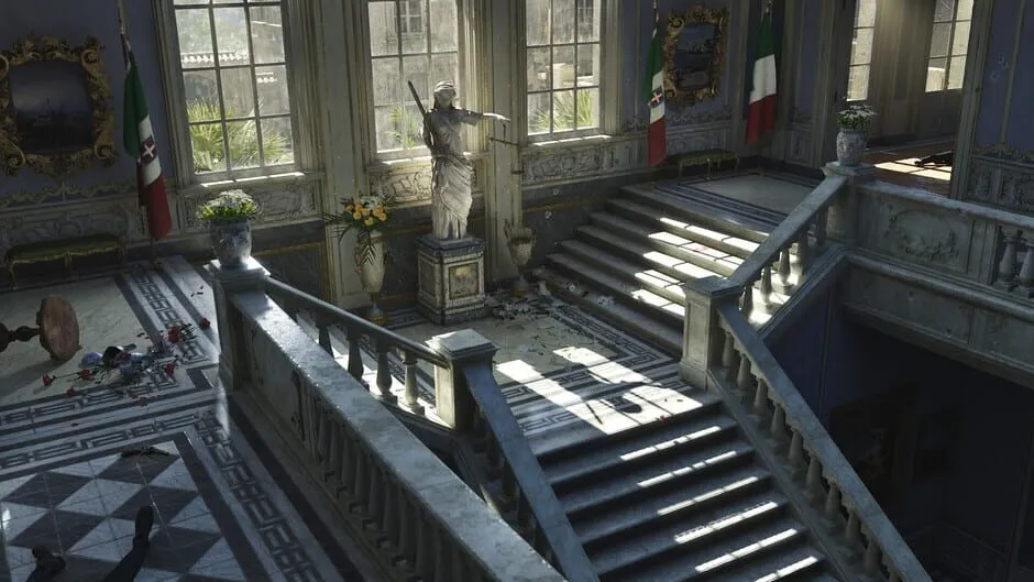 A grand marble staircase in a Sicilian villa, with Italian flags hanging from the walls
