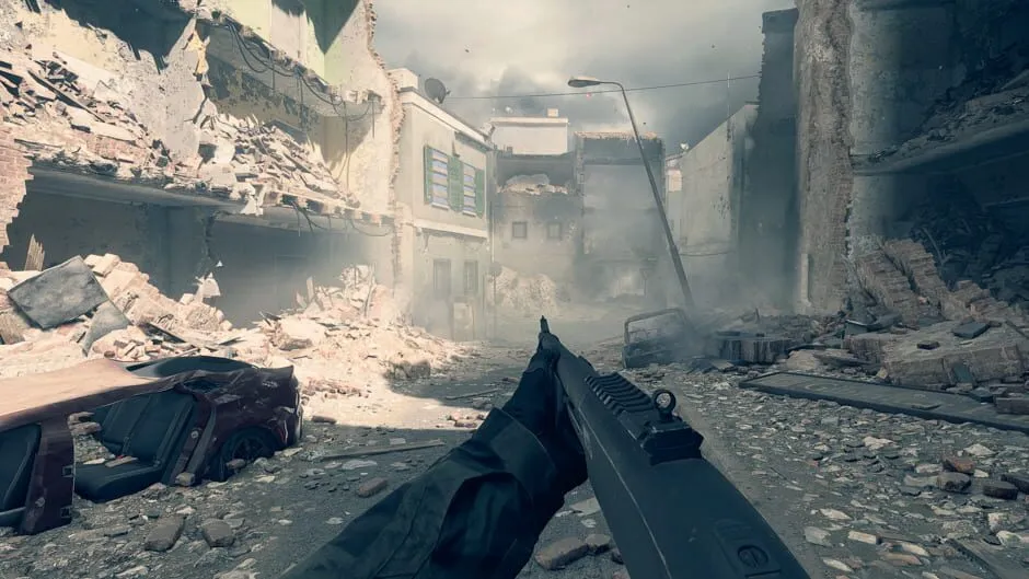 A first-person view of a shotgun in a rubble-strewn city street with collapsed buildings on both sides